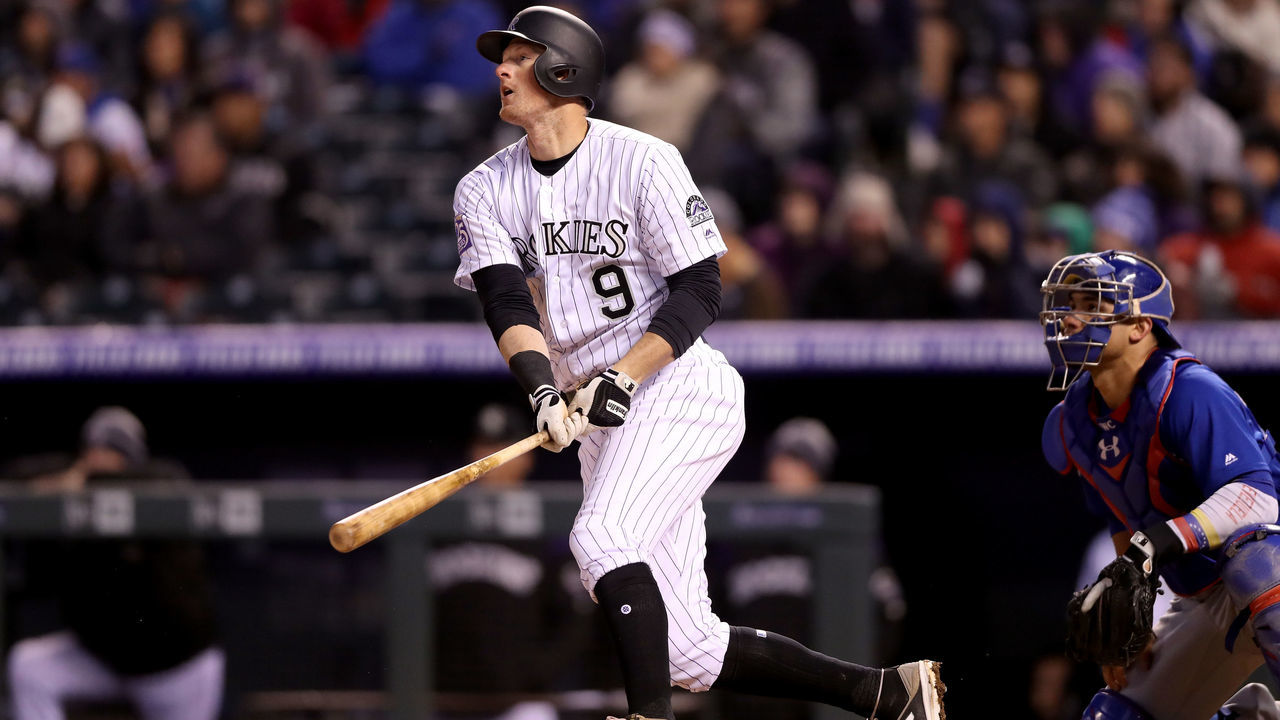 DENVER, CO - APRIL 21: D.J. LeMahieu #9 of the Colorado Rockies hits a RBI double in the fifth inning against the Chicago Cubs at Coors Field on April 21, 2018 in Denver, Colorado.