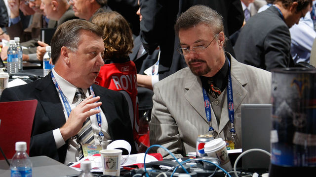 MONTREAL , QC - JUNE 27: (L-R) General Manager Don Waddell and Associate General Manager Rick Dudley of the Atlanta Thrashers share a conversation at the Thrashers draft table during the second day of the 2009 NHL Entry Draft at the Bell Centre on June 27, 2009 in Montreal, Quebec, Canada.