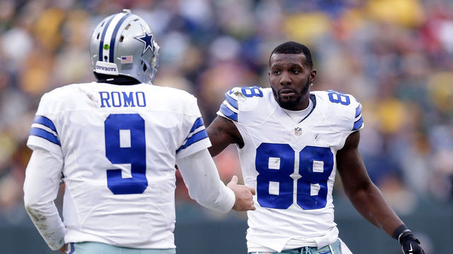 GREEN BAY, WI - JANUARY 11: Quarterback Tony Romo #9 and Dez Bryant #88 of the Dallas Cowboys react during the 2015 NFC Divisional Playoff game against the Green Bay Packers at Lambeau Field on January 11, 2015 in Green Bay, Wisconsin.