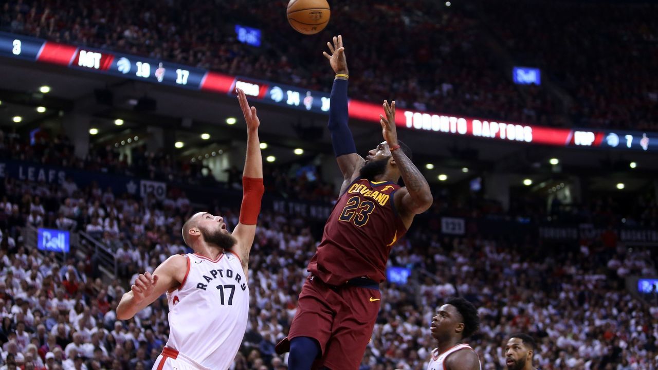 TORONTO, ON - MAY 01: LeBron James #23 of the Cleveland Cavaliers shoots the ball as Jonas Valanciunas #17 of the Toronto Raptors defends in the second half of Game One of the Eastern Conference Semifinals during the 2018 NBA Playoffs at Air Canada Centre on May 1, 2018 in Toronto, Canada.