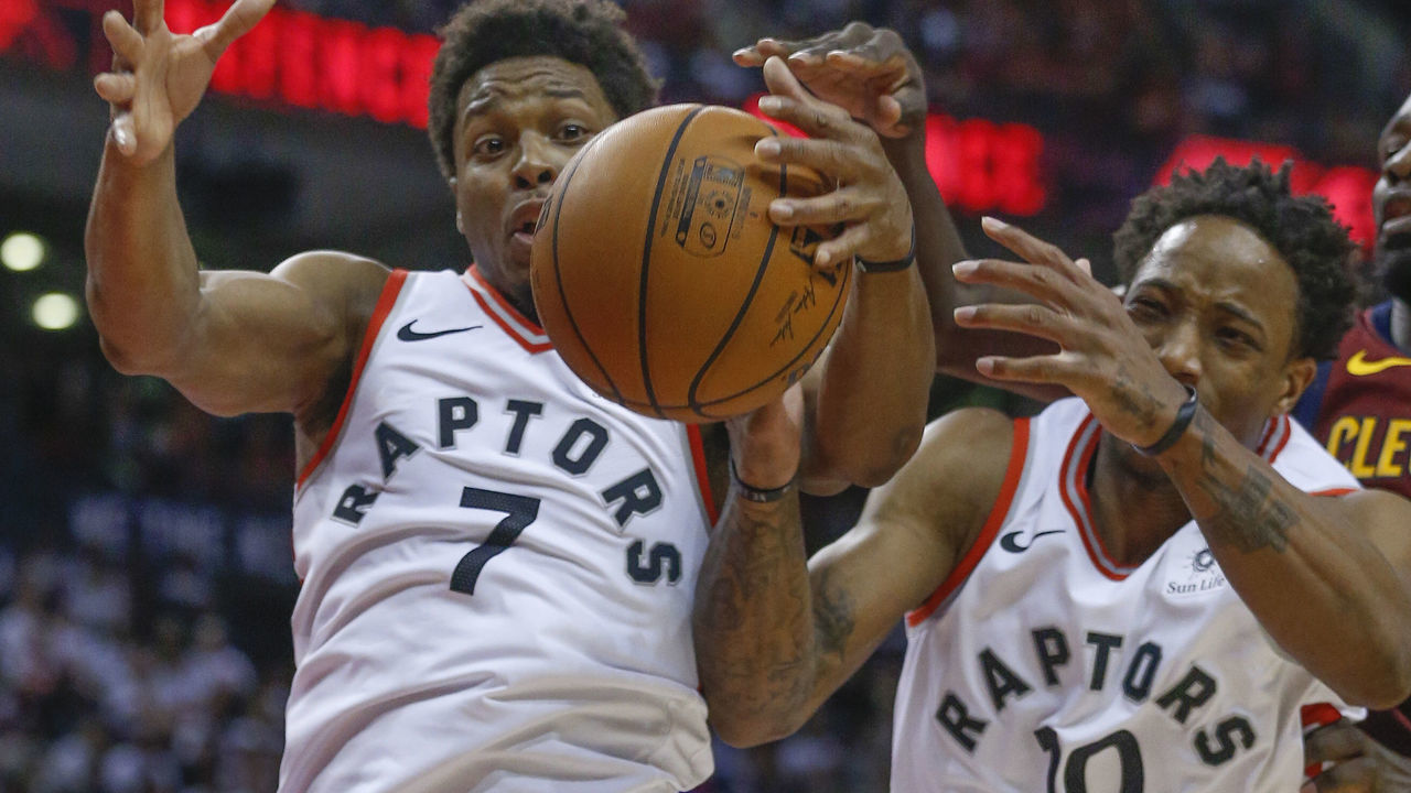 TORONTO, ON - MAY 1: Toronto Raptors guard Kyle Lowry (7) and Toronto Raptors guard DeMar DeRozan (10) hustle for a loose ball under the defensive board. Toronto Raptors vs Cleveland Cavaliers in 2nd half action of Game 1 of NBA Eastern Conference semi final playoff play at Air Canada Centre. Raptors lost 113-112 in OT. Toronto Star/Rick Madonik (Rick Madonik/Toronto Star via Getty Images)