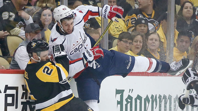 PITTSBURGH, PA - MAY 01: Tom Wilson #43 of the Washington Capitals checks Chad Ruhwedel #2 of the Pittsburgh Penguins while chasing after the puck during the first period in Game Three of the Eastern Conference Second Round during the 2018 NHL Stanley Cup Playoffs at PPG PAINTS Arena on May 1, 2018 in Pittsburgh, Pennsylvania.