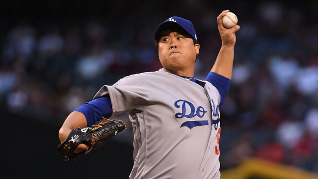 PHOENIX, AZ - MAY 02: Hyun-Jin Ryu #99 of the Los Angeles Dodgers delivers a first inning pitch against the Arizona Diamondbacks at Chase Field on May 2, 2018 in Phoenix, Arizona.
