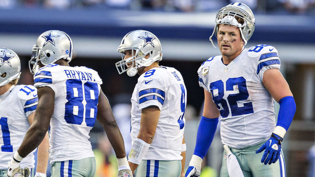 ARLINGTON, TX - NOVEMBER 3: Tony Romo #9 and Jason Witten #82 escort Dez Bryant #88 of the Dallas Cowboys to the sidelines during a game against the Minnesota Vikings at AT&T Stadium on November 3, 2013 in Arlington, Texas. The Cowboys defeated the Vikings 27-23.