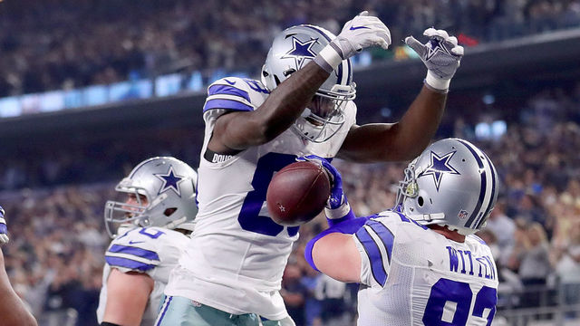 ARLINGTON, TX - DECEMBER 26: Dez Bryant #88 of the Dallas Cowboys celebrates after throwing a touchdown pass to Jason Witten #82 of the Dallas Cowboys against the Detroit Lions in the third quarter at AT&T Stadium on December 26, 2016 in Arlington, Texas.
