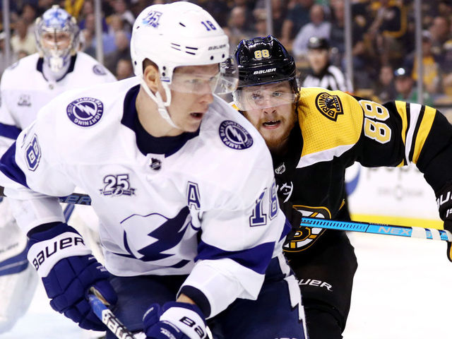 BOSTON, MA - MAY 2: David Pastrnak #88 of the Boston Bruins defends Ondrej Palat #18 of the Tampa Bay Lightning during the third period of Game Three of the Eastern Conference Second Round during the 2018 NHL Stanley Cup Playoffs at TD Garden on May 2, 2018 in Boston, Massachusetts. The Lightning defeat the Bruins 4-1.