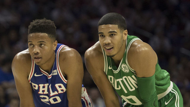 PHILADELPHIA, PA - OCTOBER 20: Markelle Fultz #20 of the Philadelphia 76ers stands next to Jayson Tatum #0 of the Boston Celtics during foul shots in the first half at the Wells Fargo Center on October 20, 2017 in Philadelphia, Pennsylvania. The Celtics defeated the 76ers 102-92.
