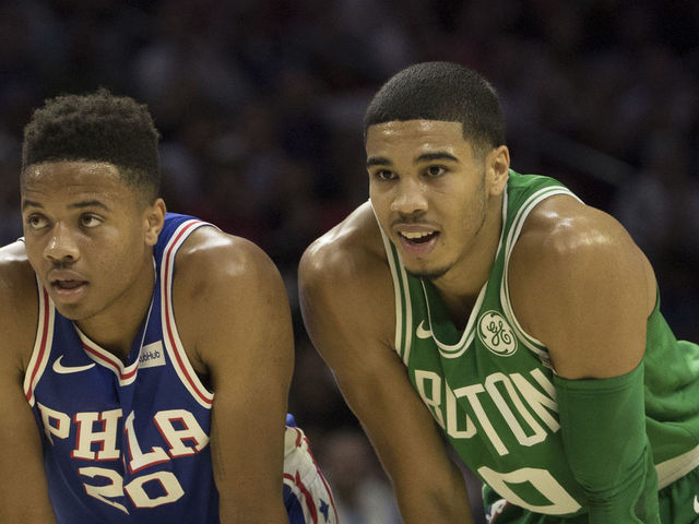 PHILADELPHIA, PA - OCTOBER 20: Markelle Fultz #20 of the Philadelphia 76ers stands next to Jayson Tatum #0 of the Boston Celtics during foul shots in the first half at the Wells Fargo Center on October 20, 2017 in Philadelphia, Pennsylvania. The Celtics defeated the 76ers 102-92.