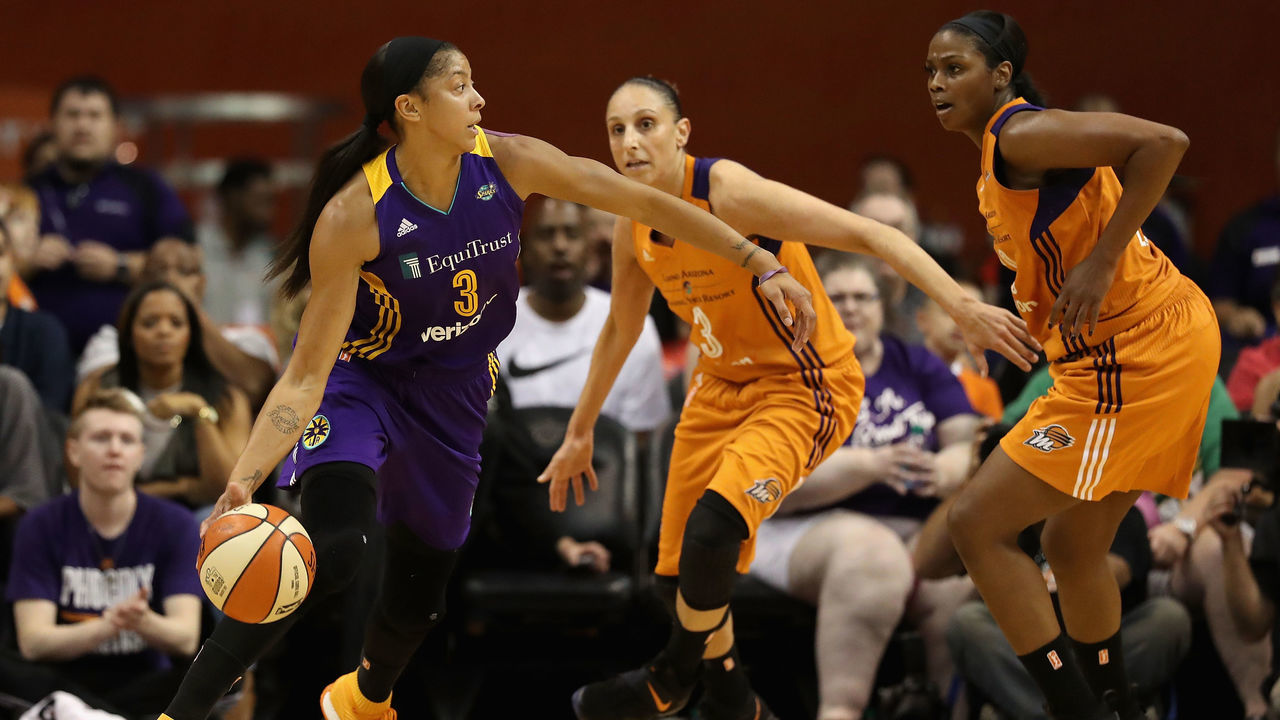 PHOENIX, AZ - SEPTEMBER 17: Candace Parker #3 of the Los Angeles Sparks handles the ball under pressure from Diana Taurasi #3 and Camille Little #20 of the Phoenix Mercury during the first half of semifinal game three of the 2017 WNBA Playoffs at Talking Stick Resort Arena on September 17, 2017 in Phoenix, Arizona. The Sparks defeated the Mercury 89-87.