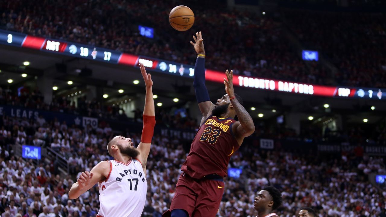 TORONTO, ON - MAY 01: LeBron James #23 of the Cleveland Cavaliers shoots the ball as Jonas Valanciunas #17 of the Toronto Raptors defends in the second half of Game One of the Eastern Conference Semifinals during the 2018 NBA Playoffs at Air Canada Centre on May 1, 2018 in Toronto, Canada.