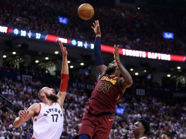TORONTO, ON - MAY 01: LeBron James #23 of the Cleveland Cavaliers shoots the ball as Jonas Valanciunas #17 of the Toronto Raptors defends in the second half of Game One of the Eastern Conference Semifinals during the 2018 NBA Playoffs at Air Canada Centre on May 1, 2018 in Toronto, Canada.