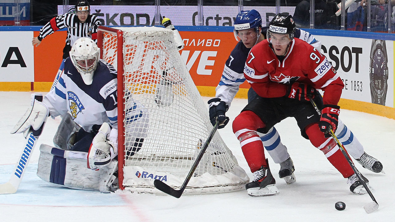MOSCOW, RUSSIA - MAY 22: Connor McDavid #97 of Canada plays the puck against Esa Lindell #7 of Finland during the 2016 IIHF World Championship gold medal game at the Ice Palace on May 22, 2016 in Moscow, Russia. Canada defeated Finland 2-0.