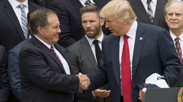 US President Donald Trump shakes hands with New England Patriots head coach Bill Belichick (L) alongside members of the team during a ceremony honoring them as 2017 Super Bowl Champions on the South Lawn of the White House in Washington, DC, April 19, 2017. / AFP PHOTO / SAUL LOEB