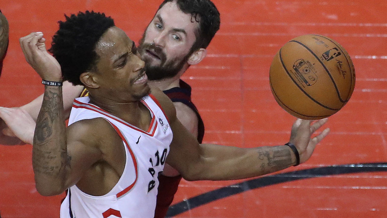 TORONTO, ON- MAY 3 - Cleveland Cavaliers center Kevin Love (0) knocks the ball away from Toronto Raptors guard DeMar DeRozan (10) as the Toronto Raptors lose game two 128-110 to the Cleveland Cavaliers in the second round of the NBA playoffs at the Air Canada Centre in Toronto. May 3, 2018. (Steve Russell/Toronto Star via Getty Images)