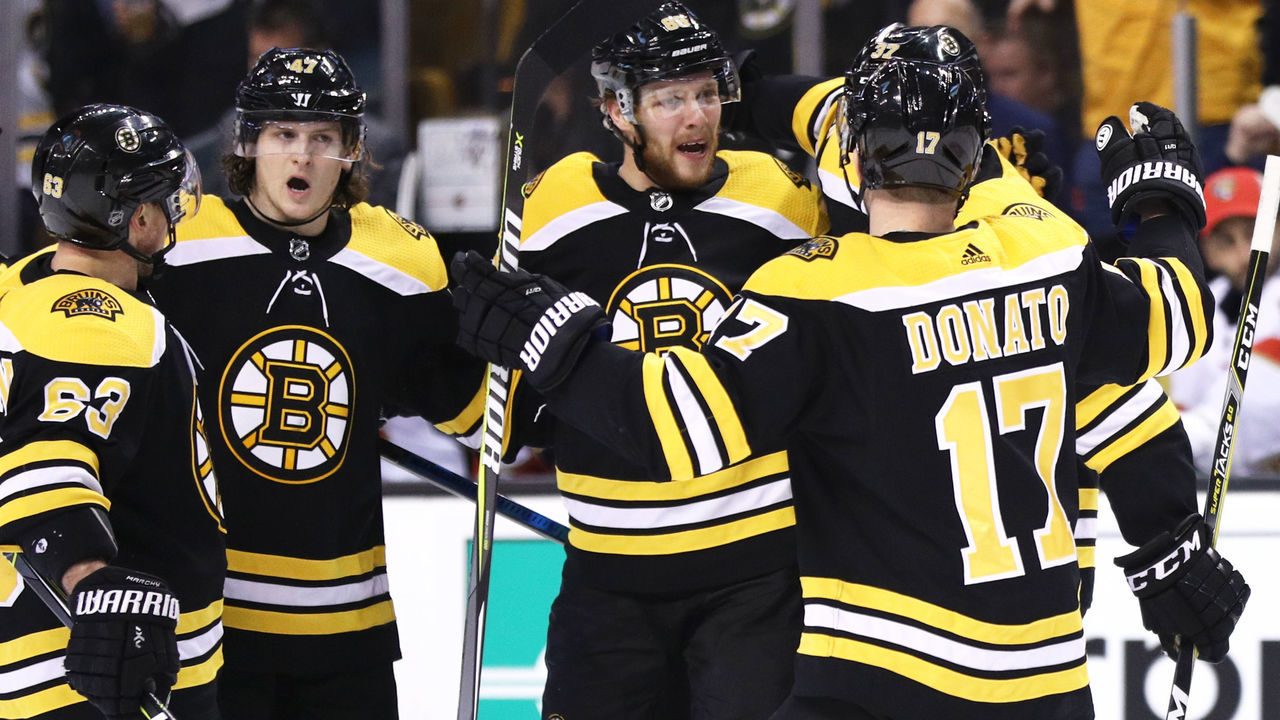 BOSTON, MA - APRIL 08: David Pastrnak #88 of the Boston Bruins celebrates with Brad Marchand #63, Torey Krug #47 and Ryan Donato #17 after scoring a goal against the Florida Panthers during the third period at TD Garden on April 8, 2018 in Boston, Massachusetts. The Panthers defeat the Bruins 4-2.