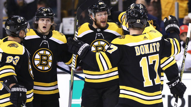 BOSTON, MA - APRIL 08: David Pastrnak #88 of the Boston Bruins celebrates with Brad Marchand #63, Torey Krug #47 and Ryan Donato #17 after scoring a goal against the Florida Panthers during the third period at TD Garden on April 8, 2018 in Boston, Massachusetts. The Panthers defeat the Bruins 4-2.