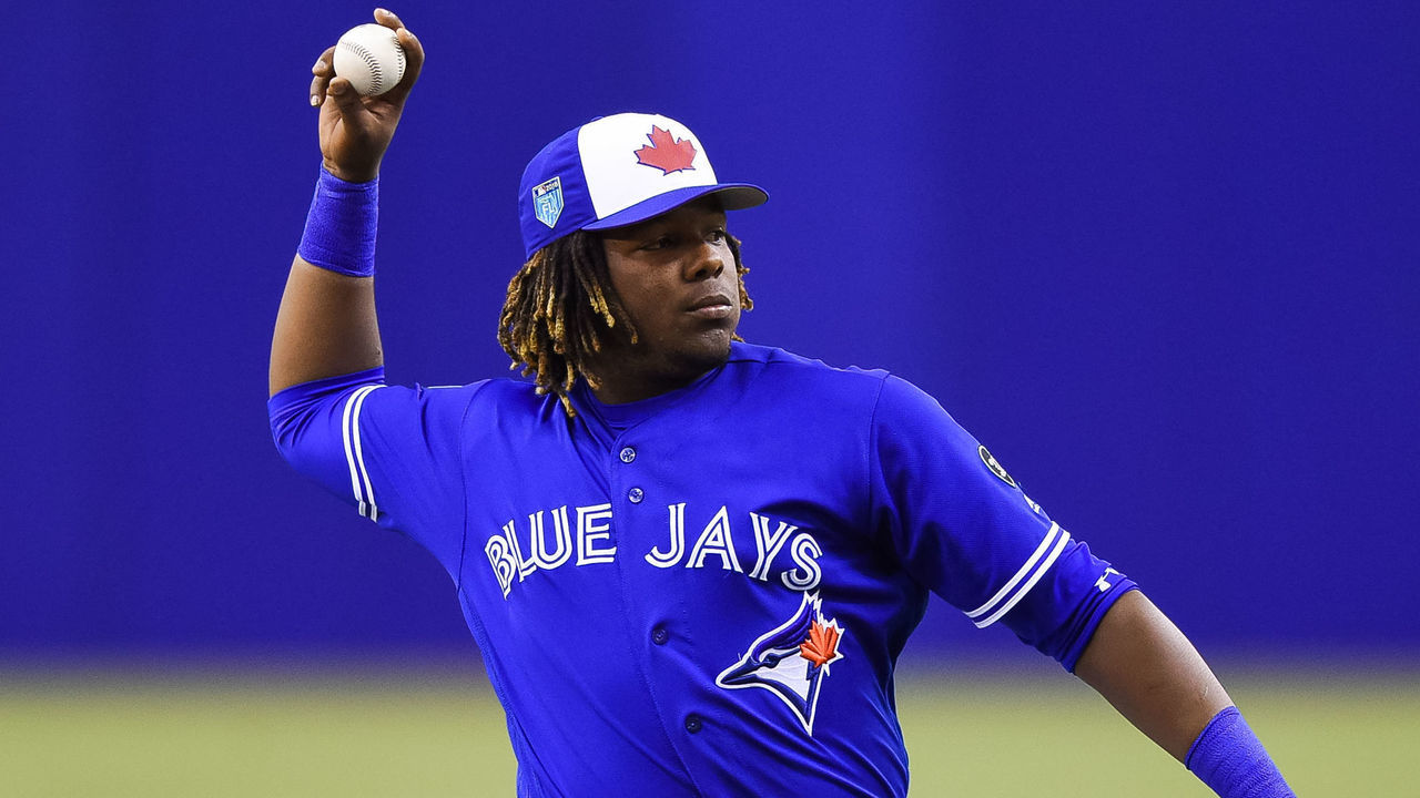 MONTREAL, QC - MARCH 27: Toronto Blue Jays infielder Vladimir Guerrero Jr. (27) pitches the ball during the St. Louis Cardinals versus the Toronto Blue Jays spring training game on March 27, 2018, at Olympic Stadium in Montreal, QC