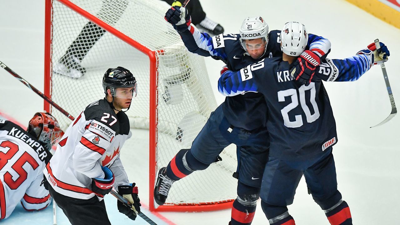 United State's Dylan Larkin (2nd R) and United States' Chris Kreider (R) celebrate scoring the 2-2 during the group B match US vs Canada of the 2018 IIHF Ice Hockey World Championship at the Jyske Bank Boxen in Herning, Denmark, on May 4, 2018.