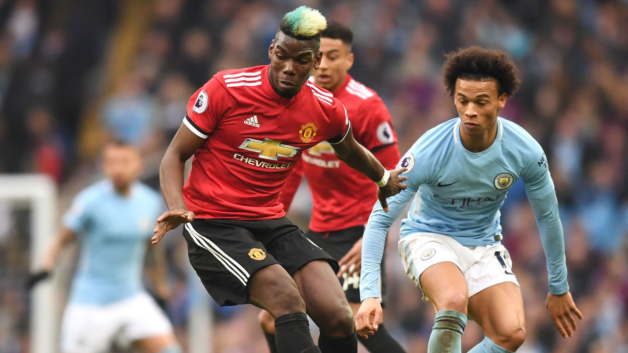 MANCHESTER, ENGLAND - APRIL 07: Paul Pogba of Manchester United is challenged by Leroy Sane of Manchester City during the Premier League match between Manchester City and Manchester United at Etihad Stadium on April 7, 2018 in Manchester, England.