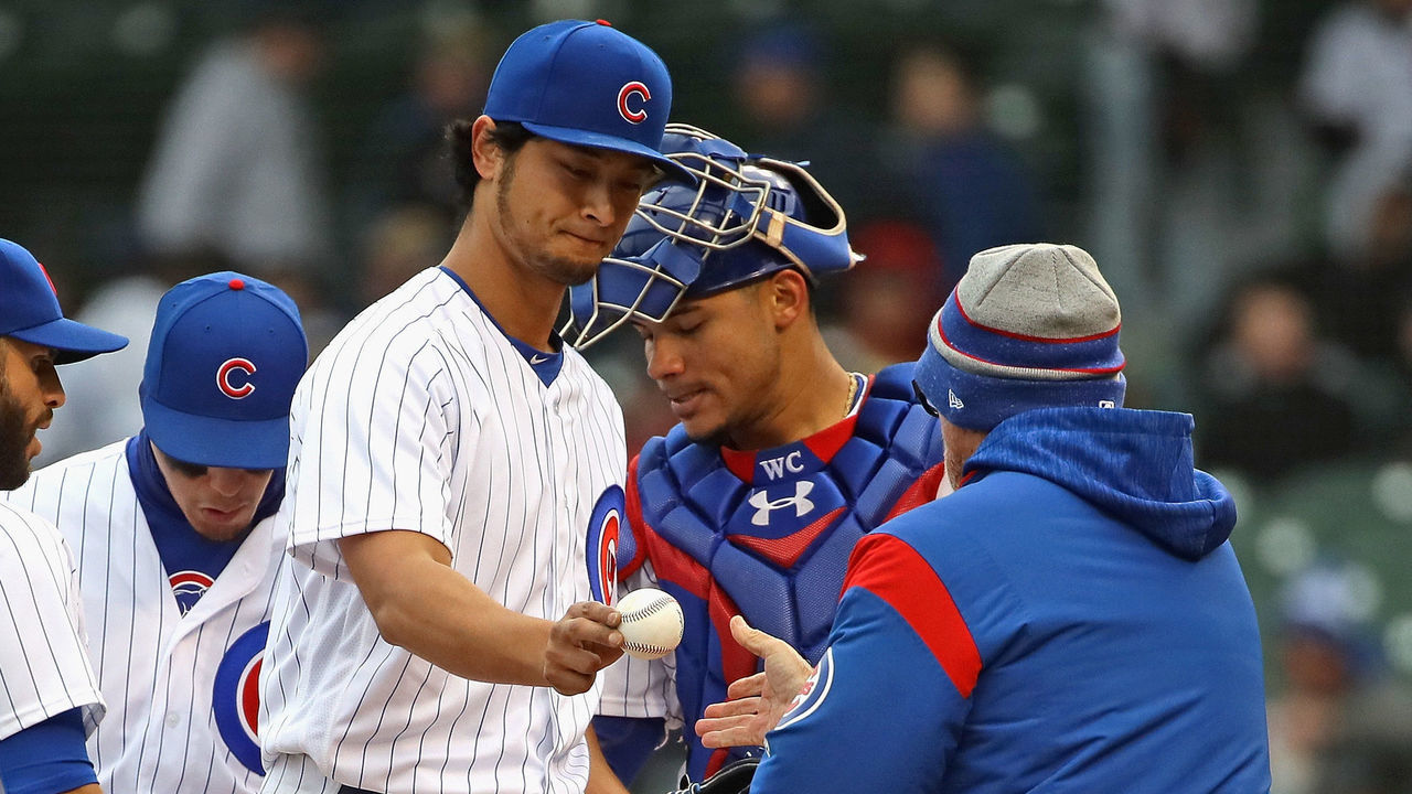 CHICAGO, IL - APRIL 13: Starting pithcer Yu Darvish #11 of the Chicago Cubs is taken out of the game against the Atlanta Braves by manager Joe Maddon #70 after loading the bases in the 5th inning at Wrigley Field on April 13, 2018 in Chicago, Illinois.