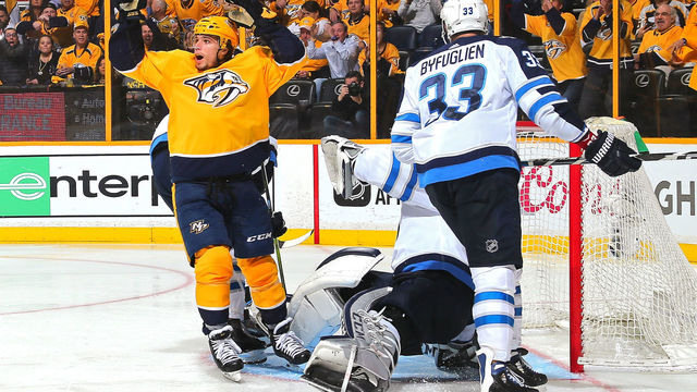 NASHVILLE, TN - APRIL 27: Kevin Fiala #22 of the Nashville Predators reacts after scoring a goal against Dustin Byfuglien #33 of the Winnipeg Jets during the third period of a 4-1 Jets victory in Game One of the Western Conference Second Round during the 2018 NHL Stanley Cup Playoffs at Bridgestone Arena on April 27, 2018 in Nashville, Tennessee.