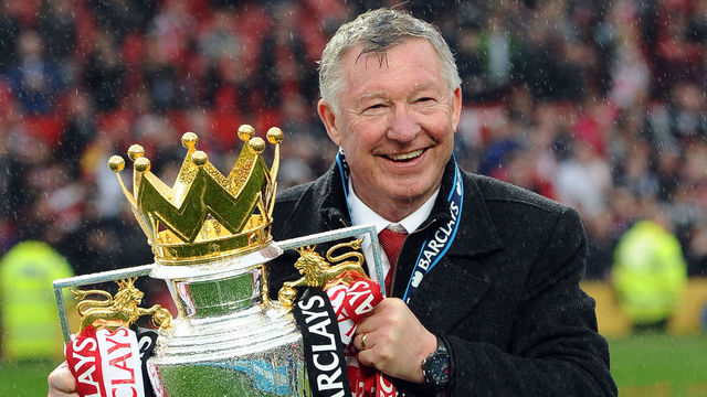 CROPPED VERSION Manchester United's Scottish manager Alex Ferguson kisses the Premier League trophy at the end of the English Premier League football match between Manchester United and Swansea City at Old Trafford in Manchester, northwest England, on May 12, 2013. Ferguson said farewell to Old Trafford with a typically passionate speech after his side's 2-1 victory over Swansea in his final home match in charge of the team. AFP PHOTO / ANDREW YATES RESTRICTED TO EDITORIAL USE. No use with unauthorized audio, video, data, fixture lists, club/league logos or “live” services. Online in-match use limited to 45 images, no video emulation. No use in betting, games or single club/league/player publications