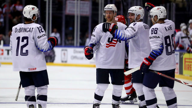 HERNING, DENMARK - MAY 05: Nick Jensen (C) of United States celebrate with his tea mates after he scores the 4th goal during the 2018 IIHF Ice Hockey World Championship group stage game between Denmark and United States at Jyske Bank Boxen on May 5, 2018 in Herning, Denmark.