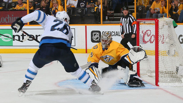 NASHVILLE, TN - MAY 05: Blake Wheeler #26 of the Winnipeg Jets looses the puck in front of goalie Pekka Rinne #35 of the Nashville Predators during the second period of Game Five of the Western Conference Second Round during the 2018 NHL Stanley Cup Playoffs at Bridgestone Arena on May 5, 2018 in Nashville, Tennessee.
