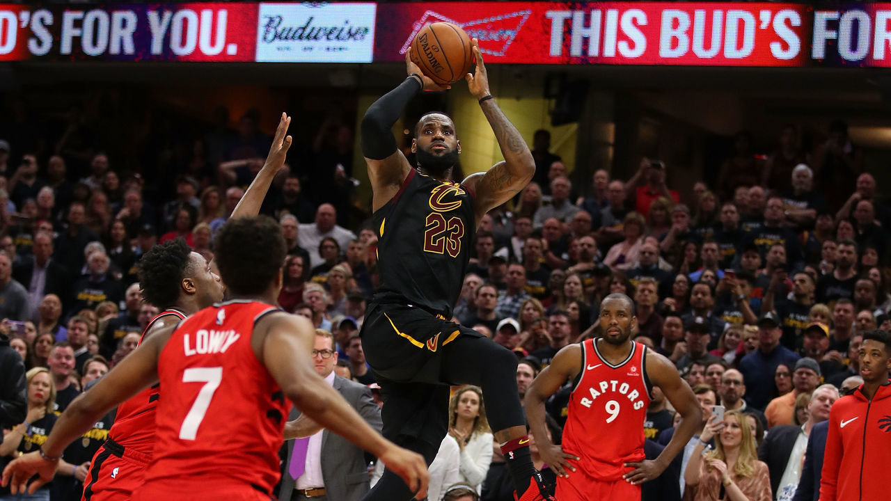 CLEVELAND, OH - MAY 05: LeBron James #23 of the Cleveland Cavaliers hits the game winning shot over the outstretched hand of OG Anunoby #3 of the Toronto Raptors to win Game Three of the Eastern Conference Semifinals 105-103 during the 2018 NBA Playoffs at Quicken Loans Arena on May 5, 2018 in Cleveland, Ohio.
