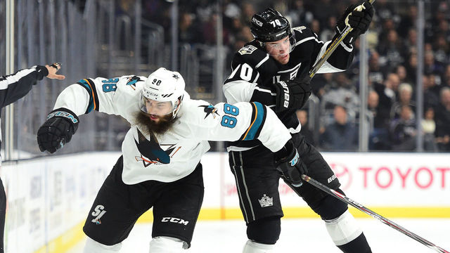 LOS ANGELES, CA - NOVEMBER 30: Tanner Pearson #70 of the Los Angeles Kings takes a check from Brent Burns #88 of the San Jose Sharks during the second period at Staples Center on November 30, 2016 in Los Angeles, California.