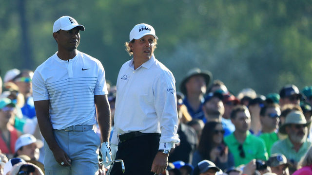AUGUSTA, GA - APRIL 03: Tiger Woods and Phil Mickelson of the United States look on from the 12th tee during a practice round prior to the start of the 2018 Masters Tournament at Augusta National Golf Club on April 3, 2018 in Augusta, Georgia.