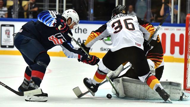 US Blake Coleman fights for the puck with Germany's Yannic Seidenberg (R) during the group B match US vs Germany of the 2018 IIHF Ice Hockey World Championship at the Jyske Bank Boxen in Herning, Denmark, on May 7, 2018.