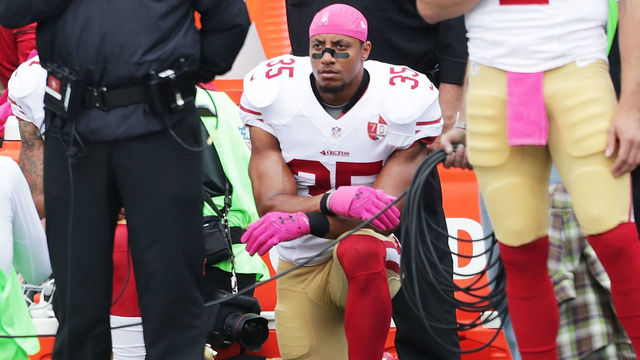 BUFFALO, NY - OCTOBER 16: Eli Harold #58 of the San Francisco 49ers, Colin Kaepernick #7 of the San Francisco 49ers (not shown) and Eric Reid #35 of the San Francisco 49ers kneel during the national anthem before the game against the Buffalo Bills at New Era Field on October 16, 2016 in Buffalo, New York.