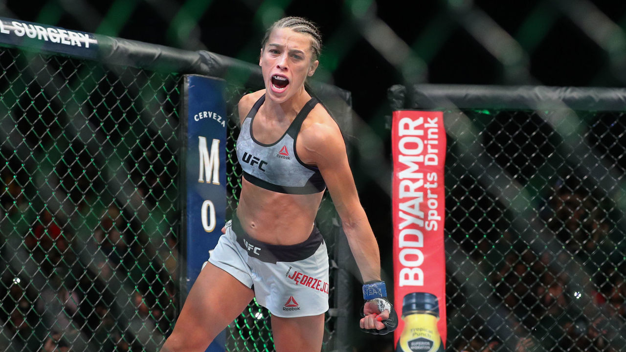 NEW YORK, NY - APRIL 07: Joanna Jedrzejczyk enters the octagon before her UFC women's strawweight championship bout at UFC 223 at Barclays Center on April 7, 2018 in New York City.