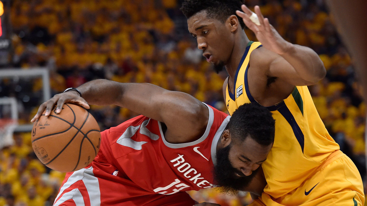 SALT LAKE CITY, UT - MAY 06: James Harden #13 of the Houston Rockets drives into defender Donovan Mitchell #45 of the Utah Jazz in the second half during Game Four of Round Two of the 2018 NBA Playoffs at Vivint Smart Home Arena on May 6, 2018 in Salt Lake City, Utah. The Rockets beat the Jazz 100-87.