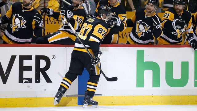 PITTSBURGH, PA - MAY 01: Sidney Crosby #87 of the Pittsburgh Penguins is congratulated by his teammates after scoring a goal during the second period in Game Three of the Eastern Conference Second Round during the 2018 NHL Stanley Cup Playoffs against the Washington Capitals at PPG PAINTS Arena on May 1, 2018 in Pittsburgh, Pennsylvania.