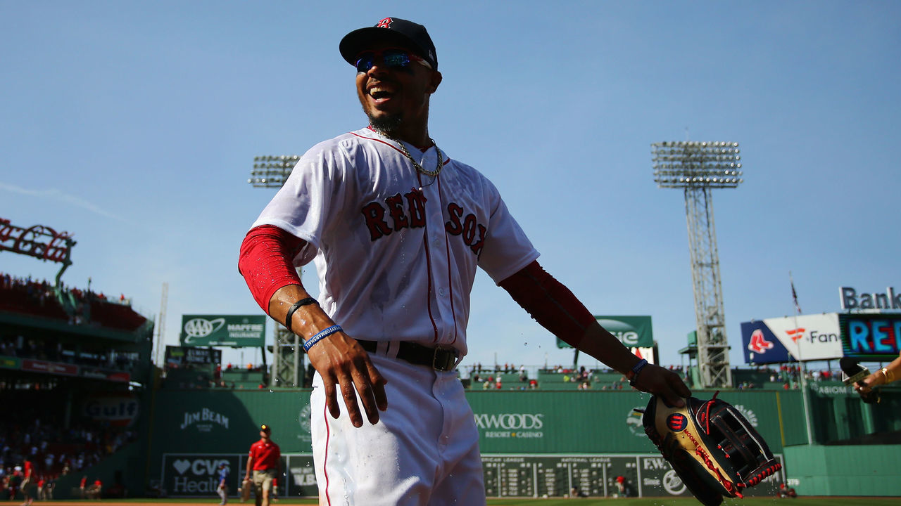 BOSTON, MA - MAY 02: Mookie Betts #50 of the Boston Red Sox reacts to being doused after defeating the Kansas City Royals 5-4 at Fenway Park on May 2, 2018 in Boston, Massachusetts.