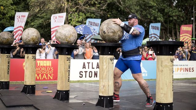 Hafthor Julius Bjornsson of Iceland lifts a concrete sphere during the Atlas Stones competition of the 2018 World's Strongest Man in Manila on May 6, 2018.
