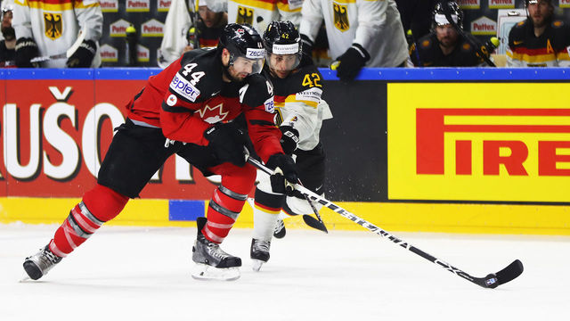 COLOGNE, GERMANY - MAY 18: Yasin Ehliz of Germany challenges Marc-Edouard Vlasic of Canada during the 2017 IIHF Ice Hockey World Championship Quarter Final game between Canada and Germany at Lanxess Arena on May 18, 2017 in Cologne, Germany.