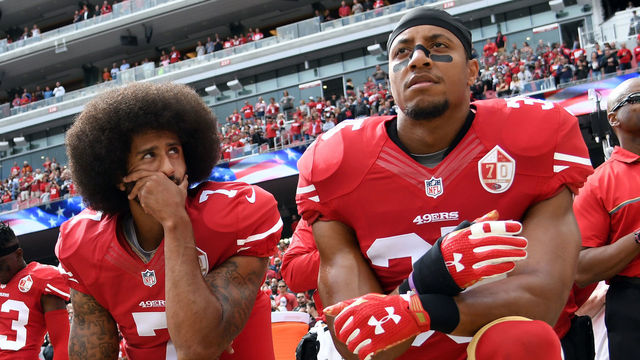 SANTA CLARA, CA - OCTOBER 02: (L-R) Eli Harold #58, Colin Kaepernick #7 and Eric Reid #35 of the San Francisco 49ers kneel on the sideline during the anthem prior to the game against the Dallas Cowboys at Levi's Stadium on October 2, 2016 in Santa Clara, California.