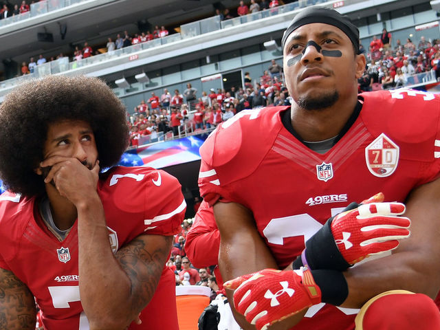 SANTA CLARA, CA - OCTOBER 02: (L-R) Eli Harold #58, Colin Kaepernick #7 and Eric Reid #35 of the San Francisco 49ers kneel on the sideline during the anthem prior to the game against the Dallas Cowboys at Levi's Stadium on October 2, 2016 in Santa Clara, California.
