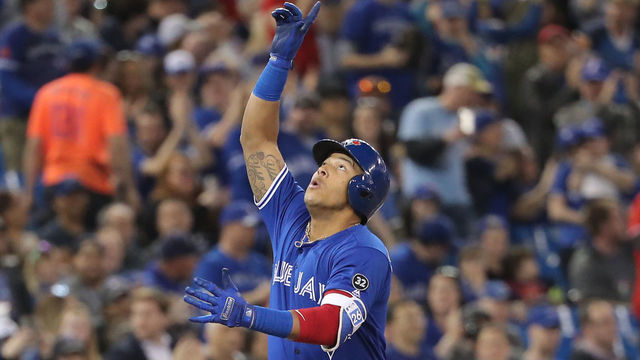 TORONTO, ON - APRIL 29: Yangervis Solarte #26 of the Toronto Blue Jays celebrates after hitting a solo home run in the second inning during MLB game action against the Texas Rangers at Rogers Centre on April 29, 2018 in Toronto, Canada.