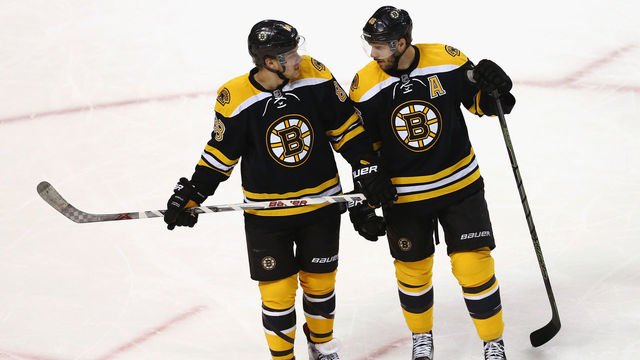 BOSTON, MA - FEBRUARY 22: David Pastrnak #88 of the Boston Bruins talks with David Krejci #46 during the first period against the Columbus Blue Jackets at TD Garden on February 22, 2016 in Boston, Massachusetts.