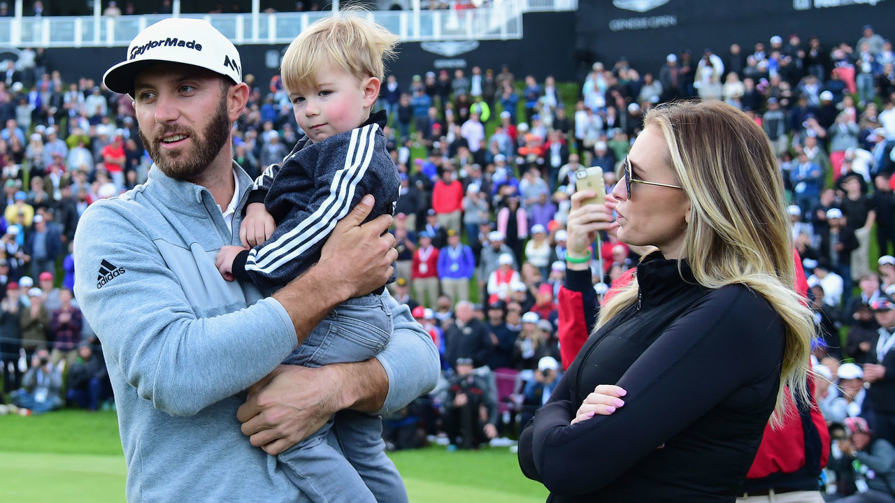 PACIFIC PALISADES, CA - FEBRUARY 19: Dustin Johnson celebrates his win with wife Paulina Gretzky and son Tatum on the 18th green during the final round at the Genesis Open at Riviera Country Club on February 19, 2017 in Pacific Palisades, California.