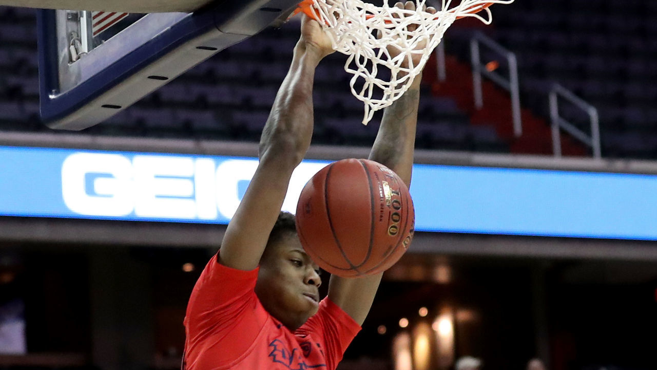WASHINGTON, DC - MARCH 8: Kostas Antetokounmpo #13 of the Dayton Flyers dunks over Khris Lane #21 of the Virginia Commonwealth Rams in the first half during the second round of the Atlantic 10 Basketball Tournament at Capital One Arena on March 8, 2018 in Washington, DC.