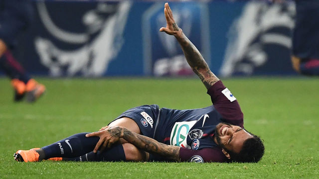 Paris Saint-Germain's Brazilian defender Daniel Alves gestures as he lies on the ground during the French Cup final football match between Les Herbiers and Paris Saint-Germain (PSG), on May 8, 2018 at the Stade de France in Saint-Denis, outside Paris. - Brazil star Dani Alves faces a race against time to be fit for the World Cup after his club Paris Saint-Germain said he would be out for at least three weeks with a knee injury. The 35-year-old suffered the injury playing in the French Cup final against Les Herbiers on May 8. Brazil play their first World Cup match against Switzerland on June 17.