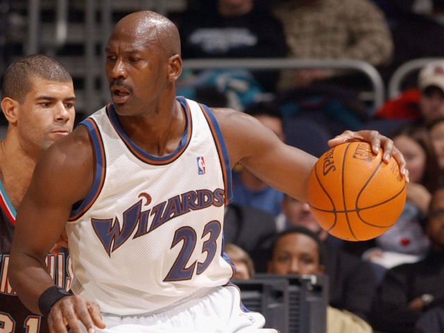 WASHINGTON - DECEMBER 18: Guard Michael Jordan #23 of the Washington Wizards drives against forward Shane Battier #31 of the Memphis Grizzlies during the game at MCI Center on December 18, 2002 in Washington, DC. The Wizards won 118-100.