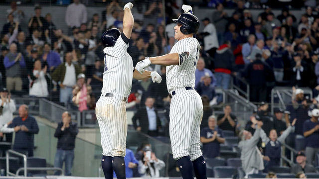 NEW YORK, NY - MAY 09: Brett Gardner #11 of the New York Yankees celebrates with teammate Aaron Judge #99 after Judge hit a home run scoring them both in the eighth inning against the Boston Red Sox at Yankee Stadium on May 9, 2018 in the Bronx borough of New York City.