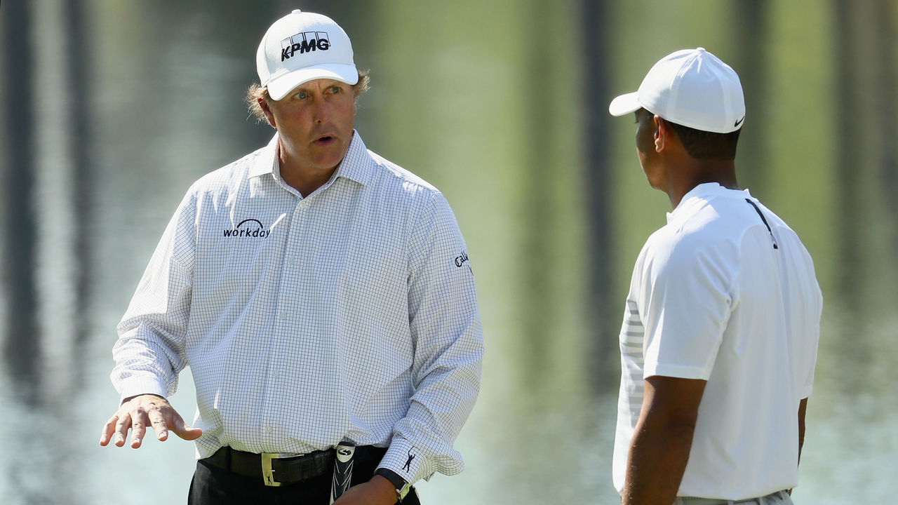 AUGUSTA, GA - APRIL 03: Tiger Woods and Phil Mickelson of the United States talk during a practice round prior to the start of the 2018 Masters Tournament at Augusta National Golf Club on April 3, 2018 in Augusta, Georgia.