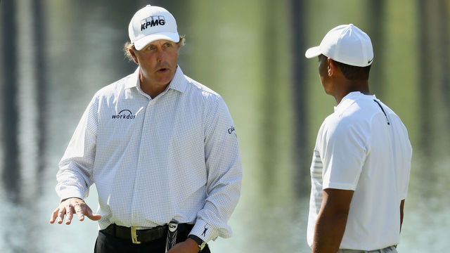 AUGUSTA, GA - APRIL 03: Tiger Woods and Phil Mickelson of the United States talk during a practice round prior to the start of the 2018 Masters Tournament at Augusta National Golf Club on April 3, 2018 in Augusta, Georgia.